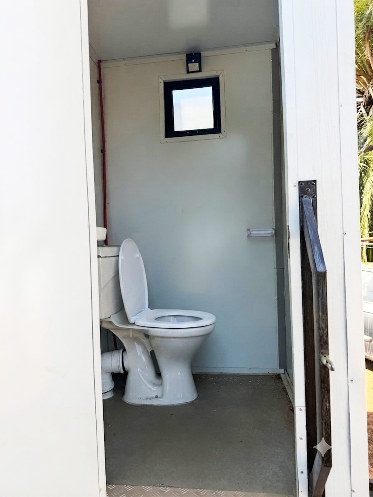 Inside a VIP mobile toilet, clean and private